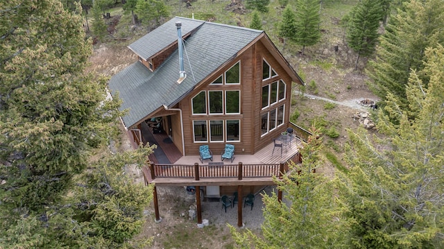 217 Forest Ridge Trl, Kila, MT 59920 - rear view of house featuring a deck and roof with shingles