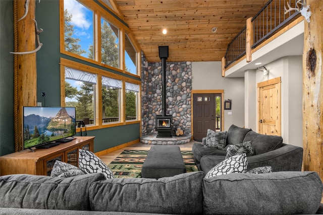 217 Forest Ridge Trl, Kila, MT 59920 - living area with a towering ceiling, a wood stove, wooden ceiling, wood finished floors, and recessed lighting