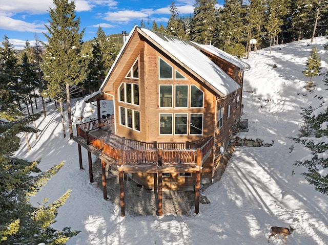 217 Forest Ridge Trl, Kila, MT 59920 - snow covered back of property featuring a deck