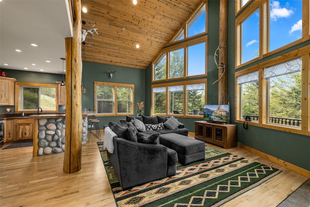 217 Forest Ridge Trl, Kila, MT 59920 - living area with high vaulted ceiling, light wood-style floors, baseboards, recessed lighting, and wood ceiling