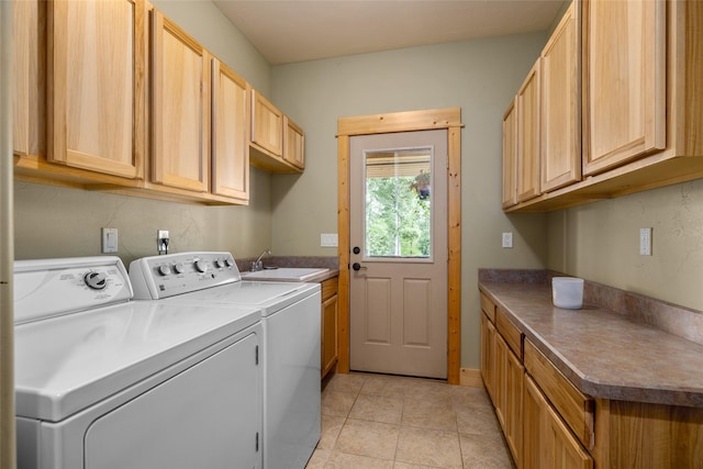 217 Forest Ridge Trl, Kila, MT 59920 - laundry area with cabinet space, washing machine and dryer, and light tile patterned floors