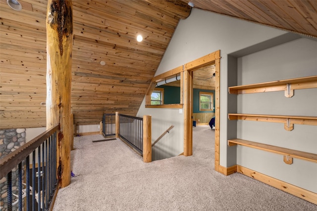217 Forest Ridge Trl, Kila, MT 59920 - corridor with an upstairs landing, carpet flooring, wood ceiling, lofted ceiling, and baseboards