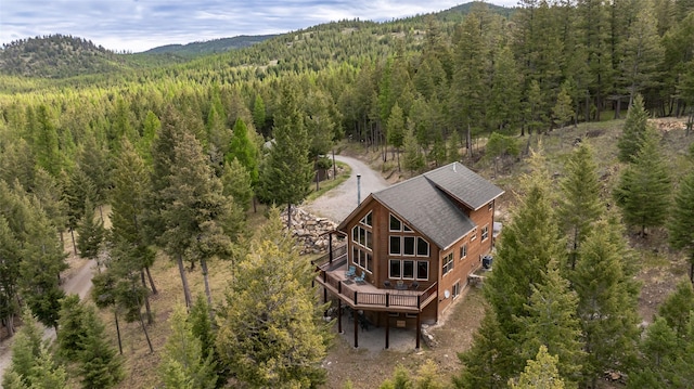 217 Forest Ridge Trl, Kila, MT 59920 - aerial view of property and surrounding area with a heavily wooded area and a mountain backdrop