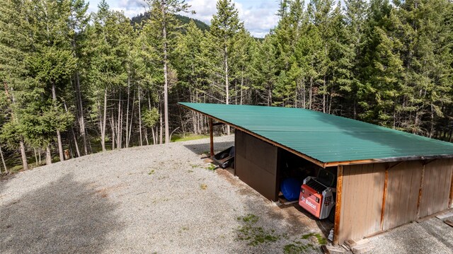 217 Forest Ridge Trl, Kila, MT 59920 - view of outbuilding with a forest view