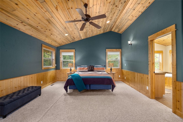 217 Forest Ridge Trl, Kila, MT 59920 - carpeted bedroom with wainscoting, wood ceiling, wooden walls, multiple windows, and vaulted ceiling
