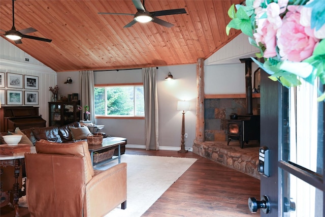 2 Cedar Grove Ln, Noxon, MT 59853 - living area with ceiling fan, vaulted ceiling, wood ceiling, a wood stove, and wood finished floors