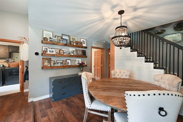 2 Cedar Grove Ln, Noxon, MT 59853 - dining space featuring a chandelier, dark wood-style floors, washer / clothes dryer, baseboards, and stairs