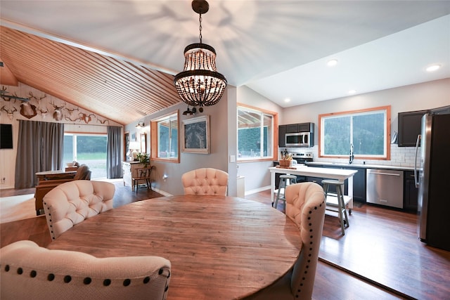 2 Cedar Grove Ln, Noxon, MT 59853 - dining space featuring a chandelier, lofted ceiling, dark wood finished floors, recessed lighting, and baseboards