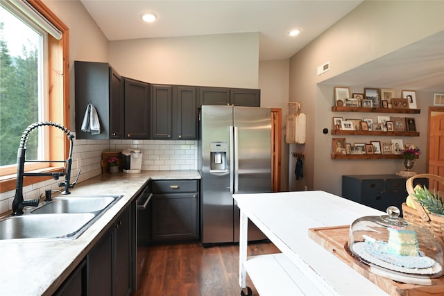2 Cedar Grove Ln, Noxon, MT 59853 - kitchen featuring stainless steel appliances, a sink, dark wood-type flooring, light countertops, and backsplash