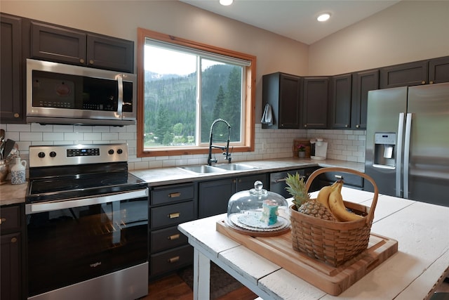 2 Cedar Grove Ln, Noxon, MT 59853 - kitchen with stainless steel appliances, a sink, light countertops, backsplash, and recessed lighting