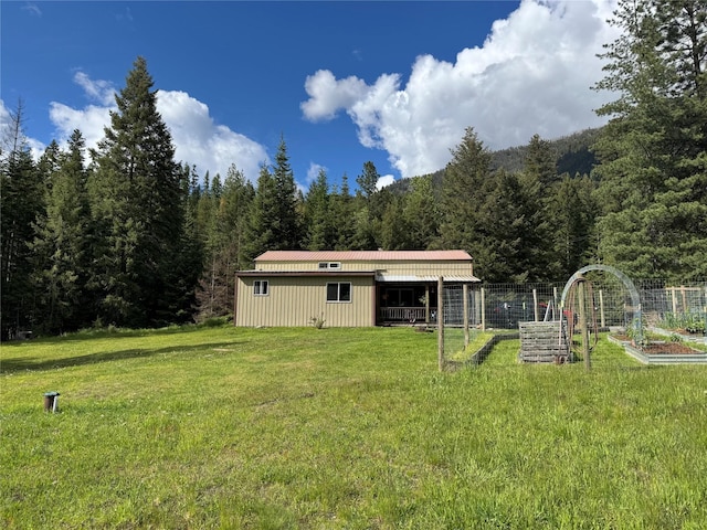 2 Cedar Grove Ln, Noxon, MT 59853 - view of yard with a garden and a view of trees