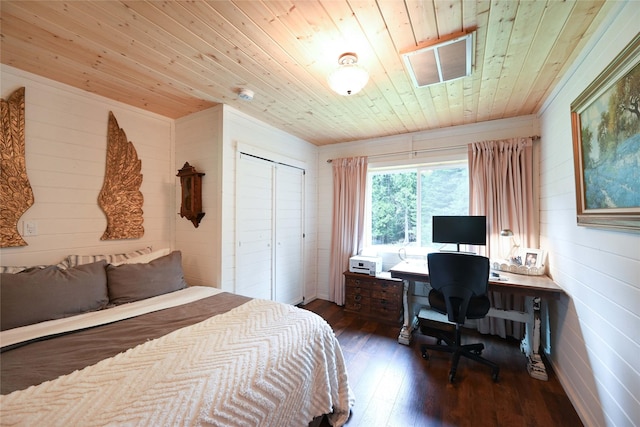 2 Cedar Grove Ln, Noxon, MT 59853 - bedroom with wooden ceiling, dark wood-style floors, a closet, a desk, and wooden walls
