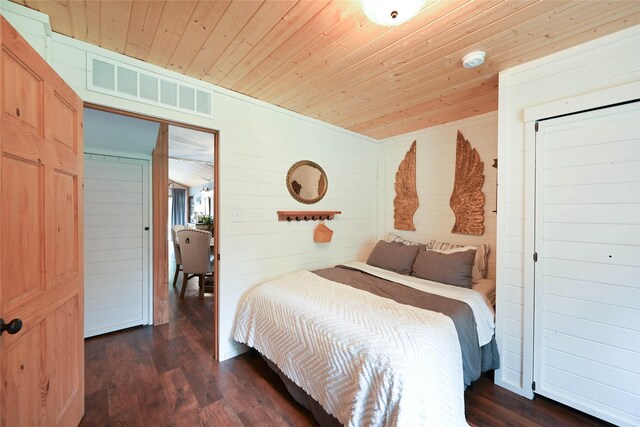 2 Cedar Grove Ln, Noxon, MT 59853 - bedroom with wooden ceiling, dark wood finished floors, and wooden walls