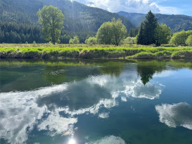 2 Cedar Grove Ln, Noxon, MT 59853 - water view with a heavily wooded area and a mountainous background
