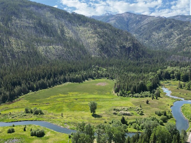 2 Cedar Grove Ln, Noxon, MT 59853 - water view with a heavily wooded area and a mountainous background