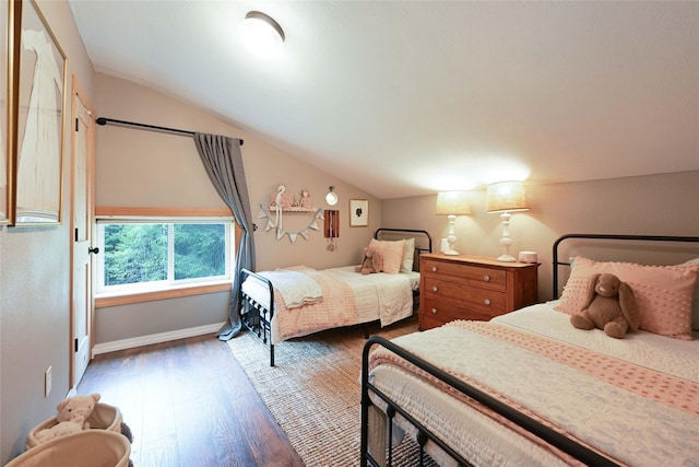 2 Cedar Grove Ln, Noxon, MT 59853 - bedroom with lofted ceiling, wood finished floors, and baseboards