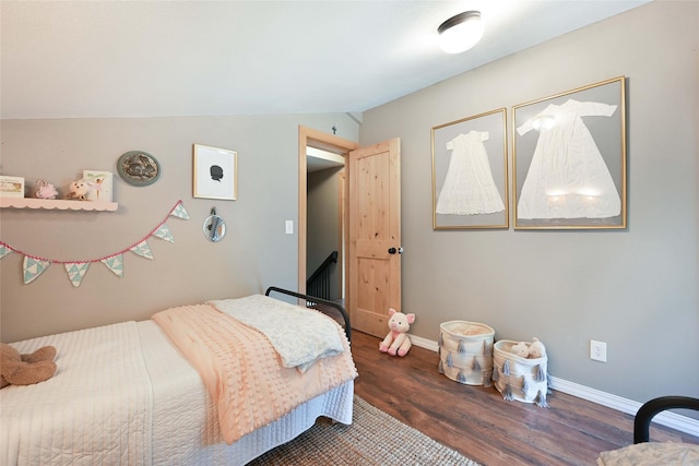 2 Cedar Grove Ln, Noxon, MT 59853 - bedroom with wood finished floors, vaulted ceiling, and baseboards