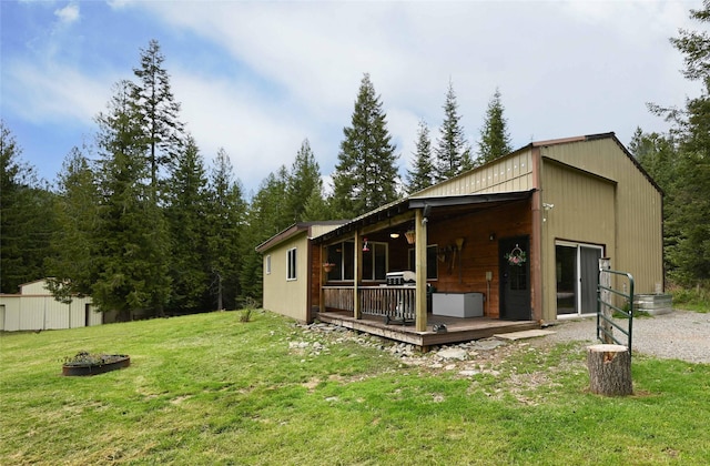 2 Cedar Grove Ln, Noxon, MT 59853 - rear view of property featuring a yard and a wooden deck