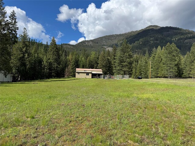 2 Cedar Grove Ln, Noxon, MT 59853 - view of mountain background featuring a heavily wooded area and a large body of water