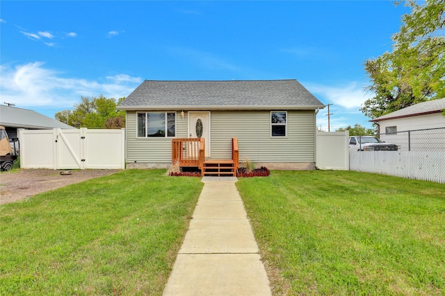 1721 13th Ave S, Great Falls, MT 59405 - back of house featuring a gate and roof with shingles