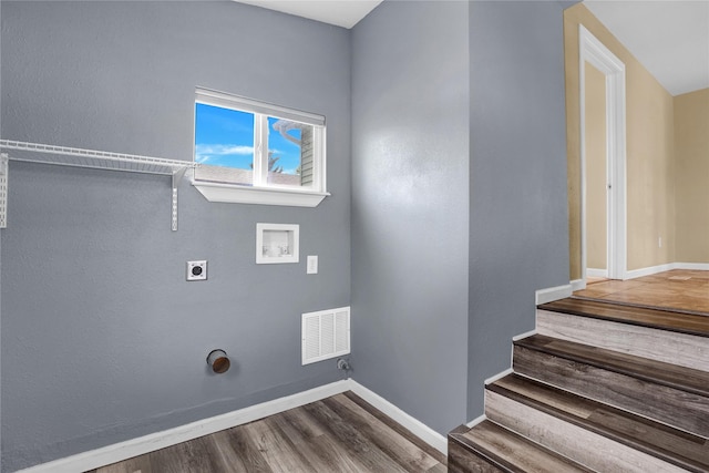 1721 13th Ave S, Great Falls, MT 59405 - laundry room featuring hookup for an electric dryer, hookup for a washing machine, wood finished floors, and baseboards