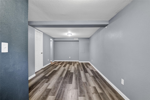 1721 13th Ave S, Great Falls, MT 59405 - unfurnished room featuring wood finished floors, a textured wall, baseboards, and a textured ceiling
