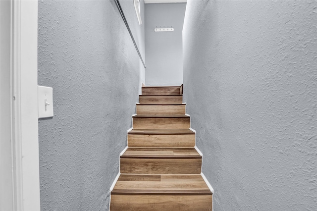 1721 13th Ave S, Great Falls, MT 59405 - stairs featuring a textured wall and wood finished floors
