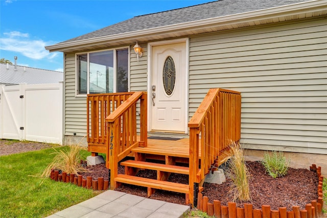1721 13th Ave S, Great Falls, MT 59405 - doorway to property with a shingled roof and a gate