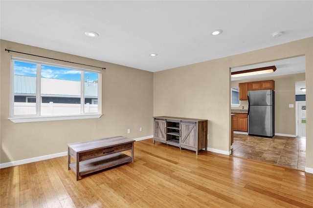 1721 13th Ave S, Great Falls, MT 59405 - spare room with light wood-type flooring, a smoke detector, baseboards, and recessed lighting