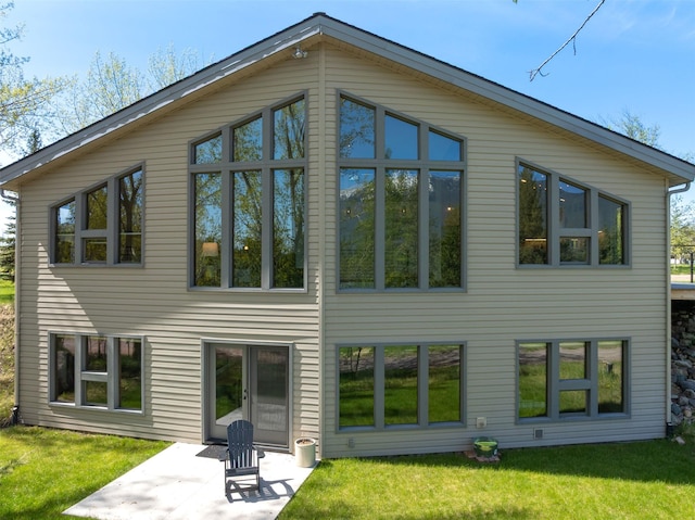 550 Talbot Rd, Columbia Falls, MT 59912 - rear view of property with a yard and a patio