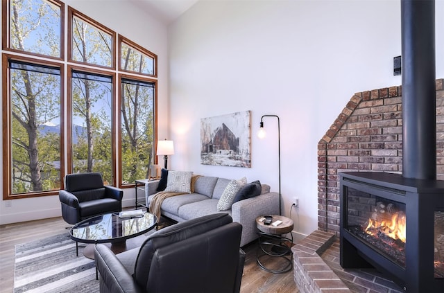 550 Talbot Rd, Columbia Falls, MT 59912 - living area with wood finished floors, plenty of natural light, a high ceiling, and baseboards