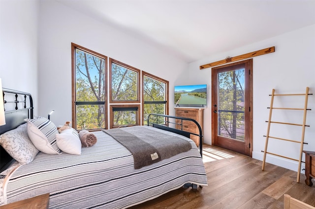 550 Talbot Rd, Columbia Falls, MT 59912 - bedroom with wood finished floors and access to outside