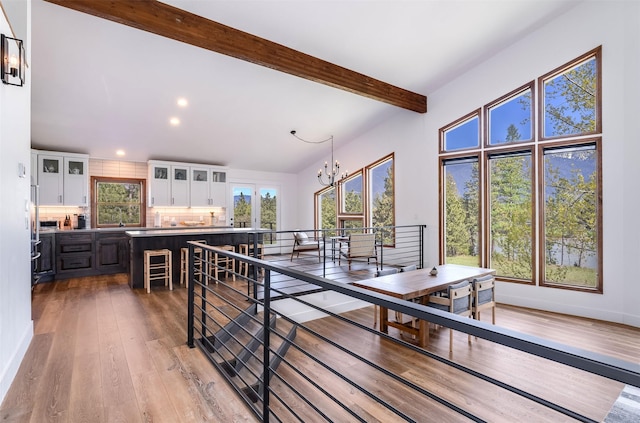 550 Talbot Rd, Columbia Falls, MT 59912 - dining space with beam ceiling, a chandelier, light wood-type flooring, and recessed lighting