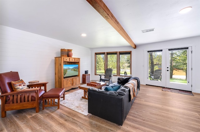 550 Talbot Rd, Columbia Falls, MT 59912 - living area featuring light wood finished floors, healthy amount of natural light, beamed ceiling, french doors, and recessed lighting