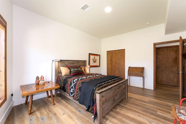550 Talbot Rd, Columbia Falls, MT 59912 - bedroom featuring wood finished floors and baseboards