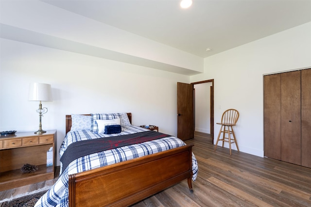 550 Talbot Rd, Columbia Falls, MT 59912 - bedroom featuring wood finished floors, a closet, and baseboards