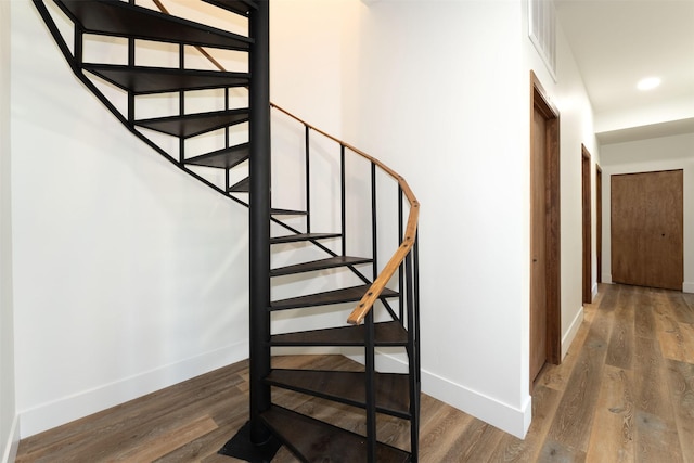 550 Talbot Rd, Columbia Falls, MT 59912 - stairs with baseboards, wood finished floors, and recessed lighting
