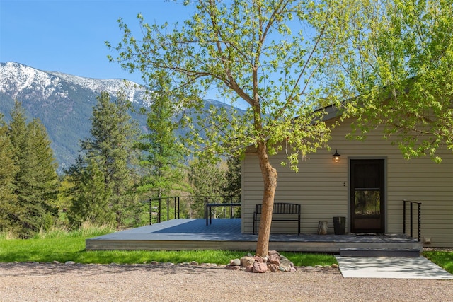 550 Talbot Rd, Columbia Falls, MT 59912 - back of property with a deck with mountain view