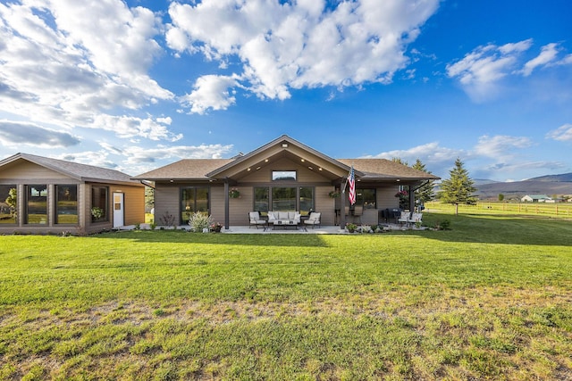 17 River Runs Ct, Plains, MT 59859 - back of property featuring a patio, an outdoor hangout area, and a mountain view