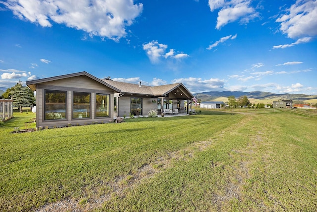 17 River Runs Ct, Plains, MT 59859 - rear view of property featuring a mountain view and a patio area