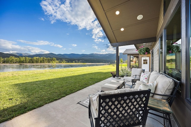 17 River Runs Ct, Plains, MT 59859 - view of patio / terrace featuring a water and mountain view
