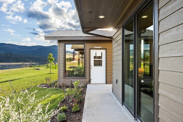 17 River Runs Ct, Plains, MT 59859 - doorway to property with a mountain view and a yard