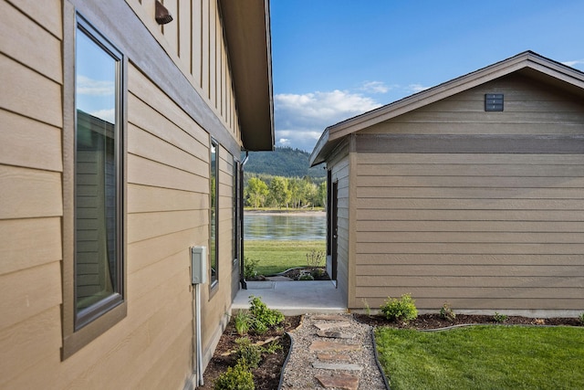 17 River Runs Ct, Plains, MT 59859 - view of side of home featuring a water view and a lawn