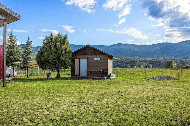 17 River Runs Ct, Plains, MT 59859 - view of yard with a deck with mountain view and an outdoor structure
