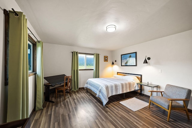 17 River Runs Ct, Plains, MT 59859 - bedroom featuring dark wood-style flooring and baseboards