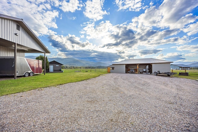 17 River Runs Ct, Plains, MT 59859 - garage with a mountain view and gravel driveway