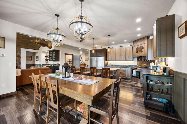 17 River Runs Ct, Plains, MT 59859 - dining room with a chandelier, dark wood-type flooring, recessed lighting, and baseboards