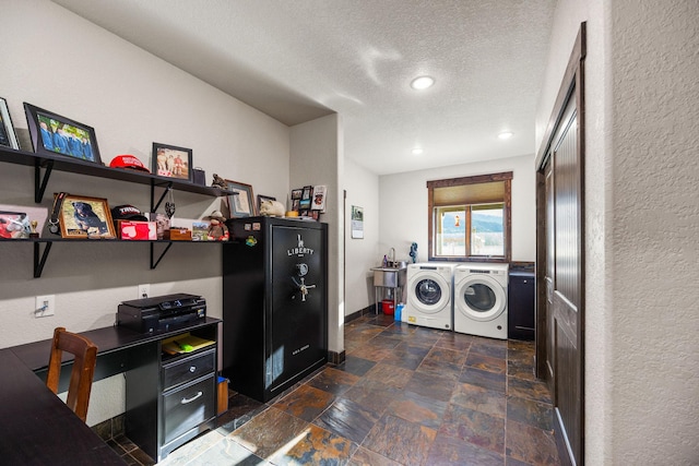 17 River Runs Ct, Plains, MT 59859 - laundry room featuring washer and clothes dryer, a textured ceiling, stone tile flooring, a textured wall, and recessed lighting