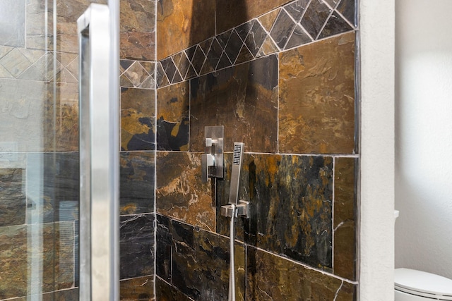 17 River Runs Ct, Plains, MT 59859 - bathroom with tiled shower and toilet