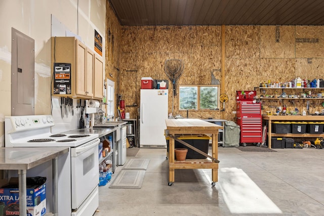 17 River Runs Ct, Plains, MT 59859 - kitchen with white appliances, electric panel, concrete flooring, and light countertops